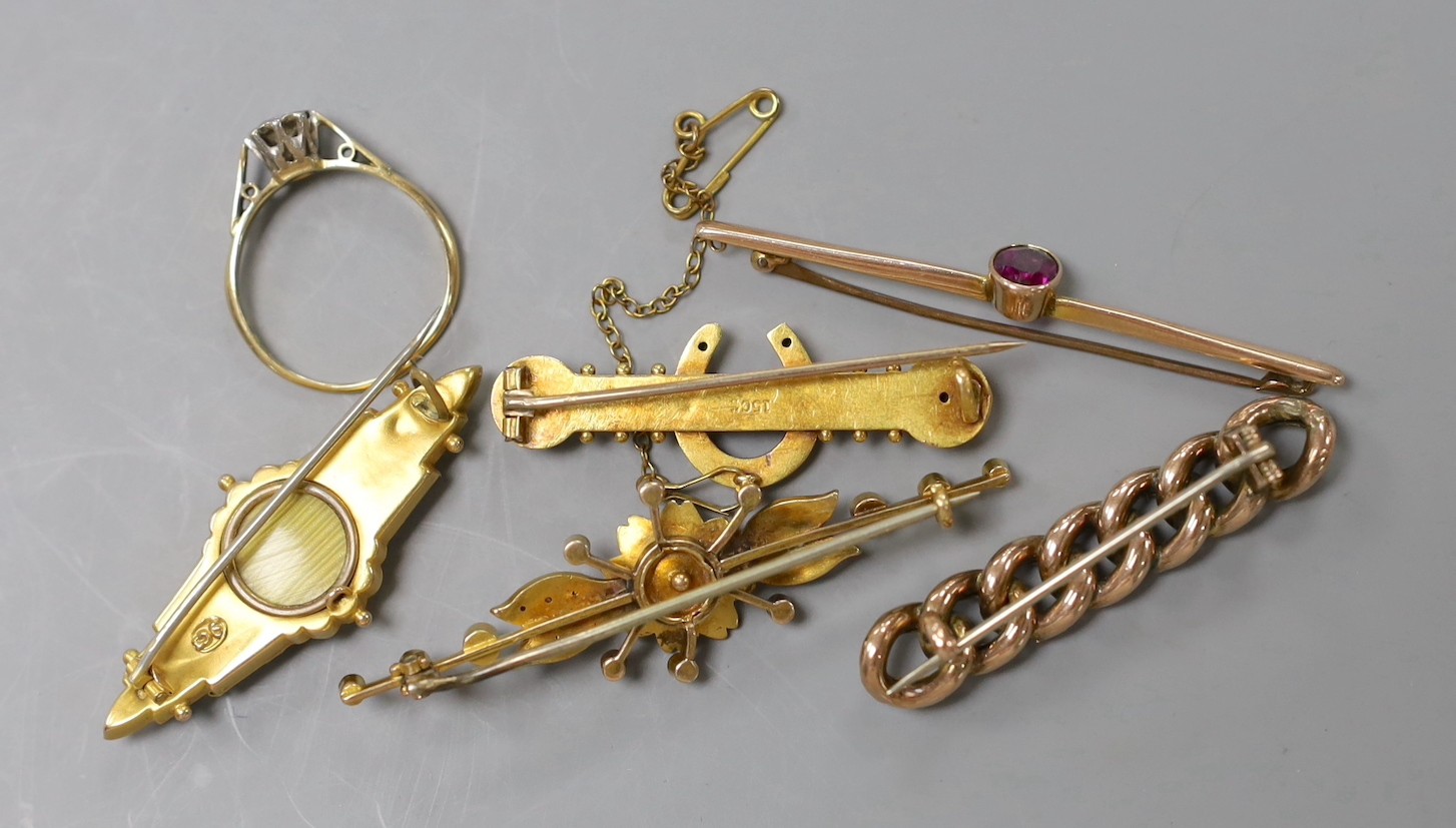 Two early 20th century 9ct and gem set bar brooches, gross weight 4.7 grams, a similar 15ct horseshoe bar brooch, gross 3.4 grams, two other yellow metal and gem set bar brooches, gross 10 grams, a 22ct gold and white op